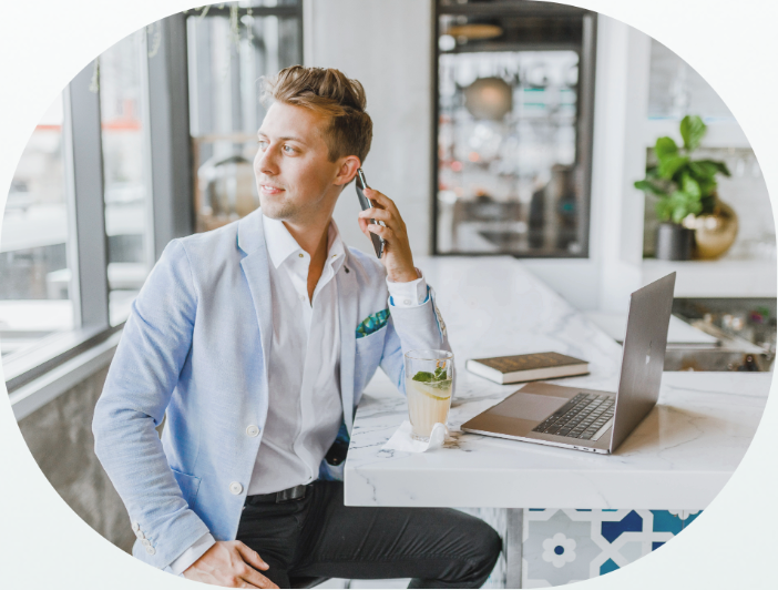 Business owner on a call while working from a laptop